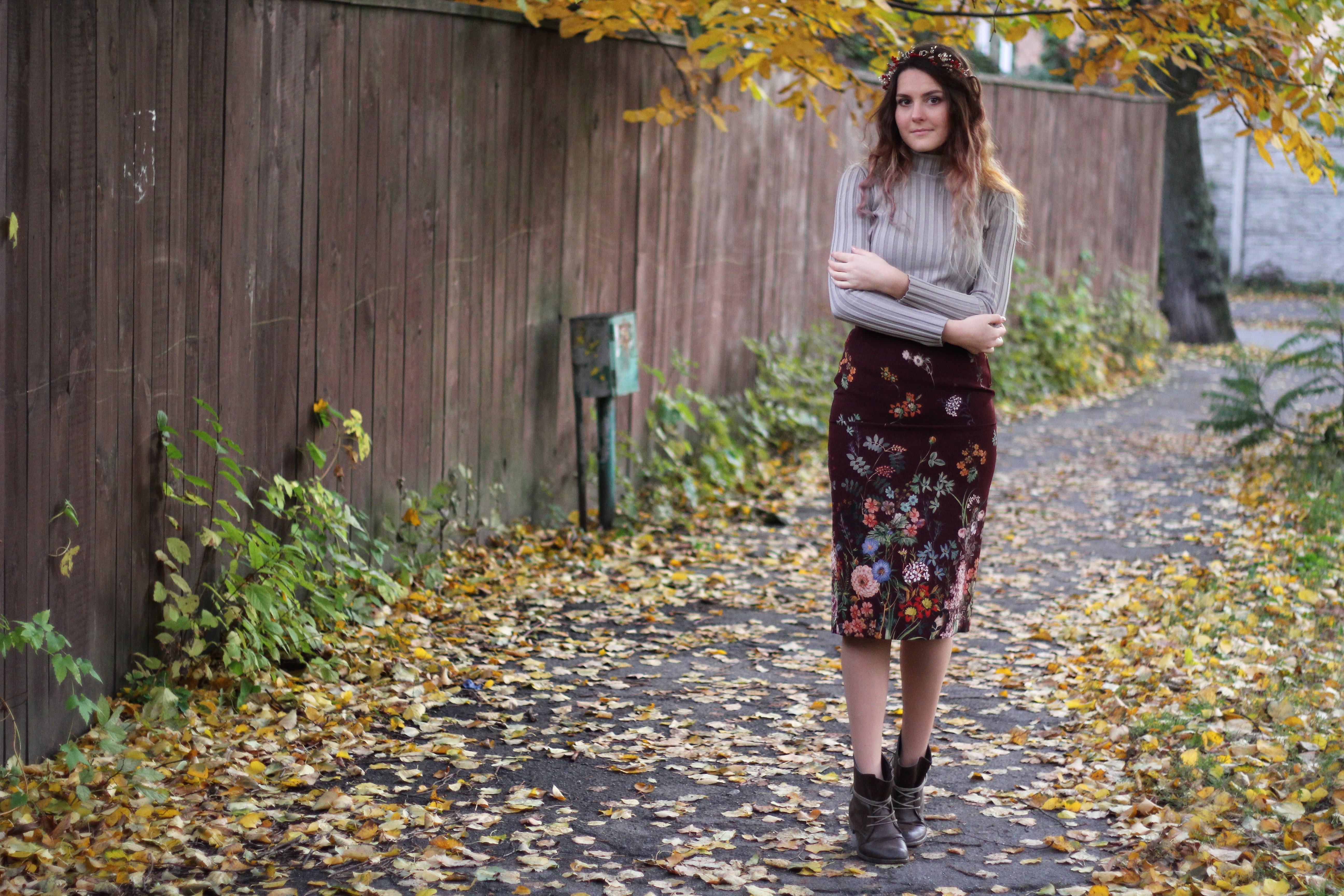 A beautiful fall inspired picture with a girl in a skirt with flowers