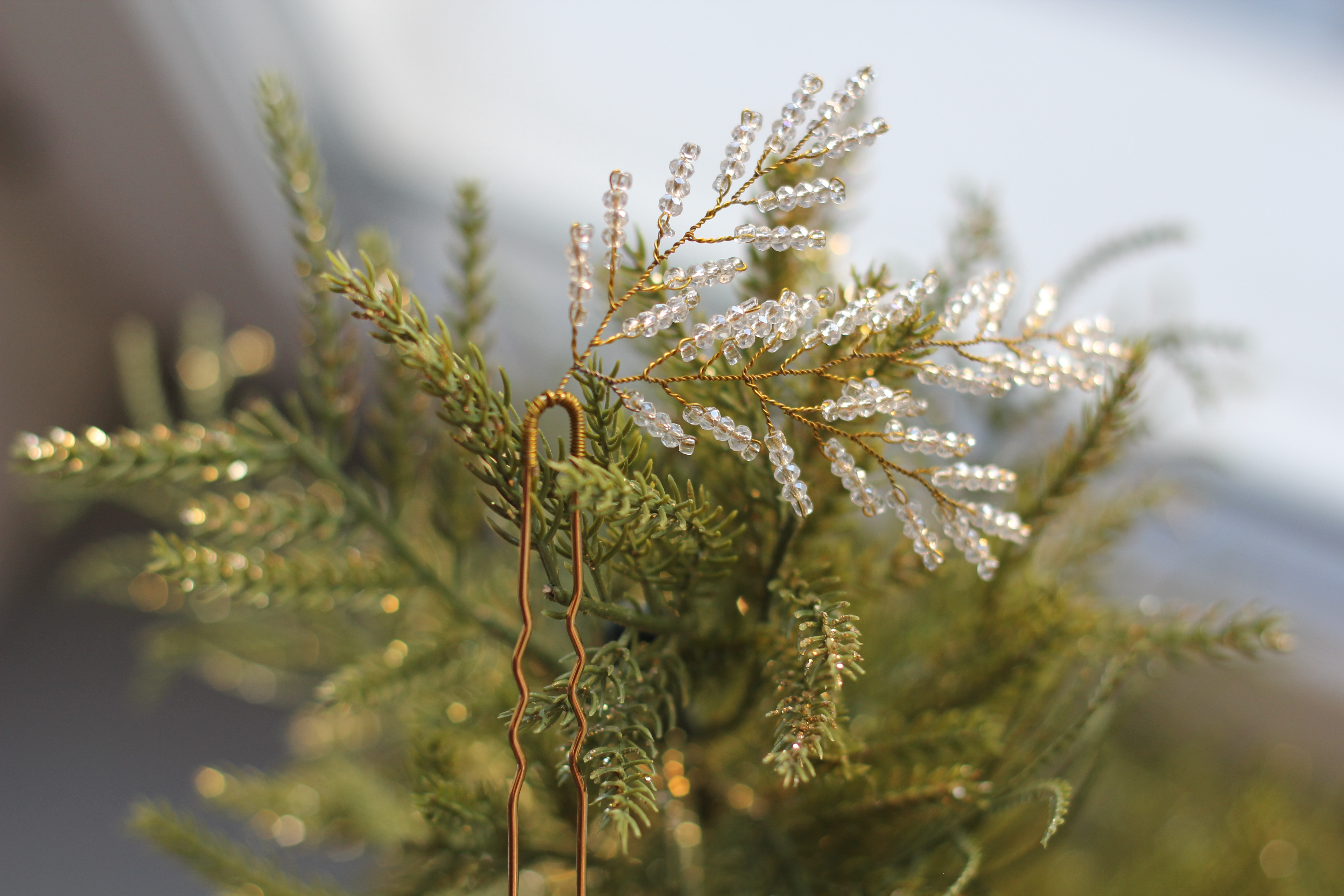 Beautiful shiny golden hair accessory in form of Christmas tree branch